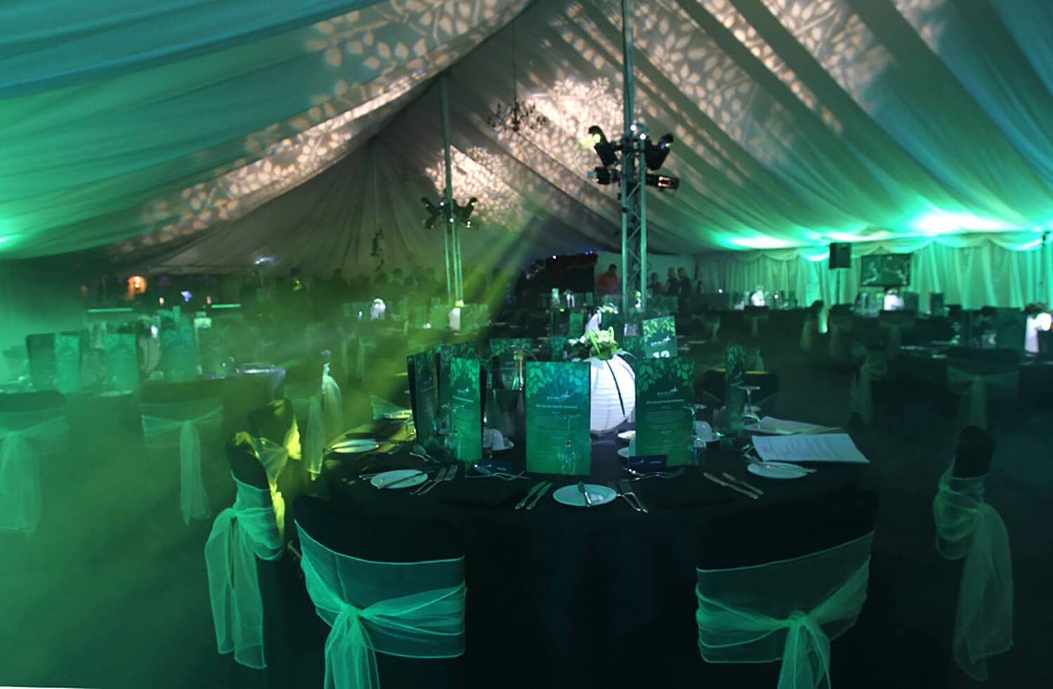 Stunning corporate event set design, lighting and sound production in grand marquee 1 Atmospheric stage, set and lighting design