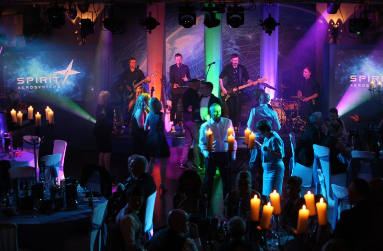Creative colourful lighting effects for stage live band performance and dance floor area